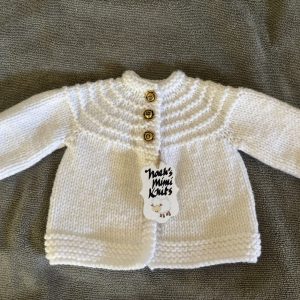 Hand Knit White Baby Sweater with Classic Rose Gold-Colored Buttons